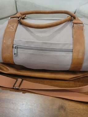 Large Duffle Bag with multiple Pockets.  Shoe space underneath.  Barely Used.